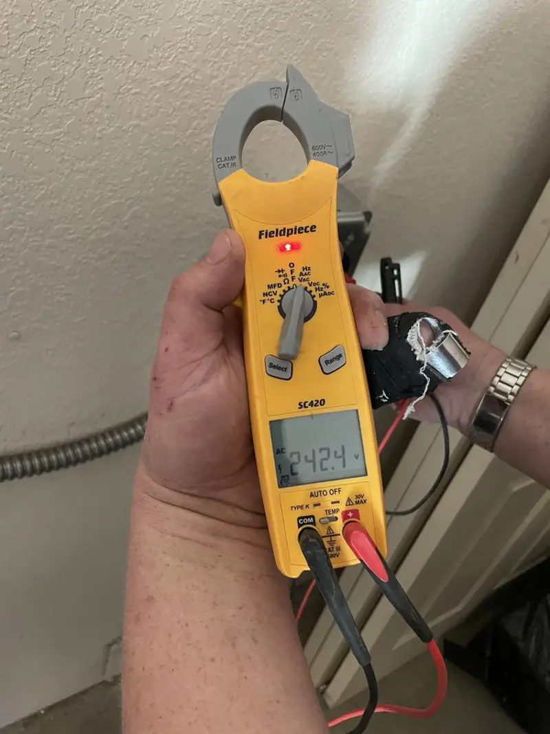 Voltage testing with clamp meter during Outlet Installation in Canisteo